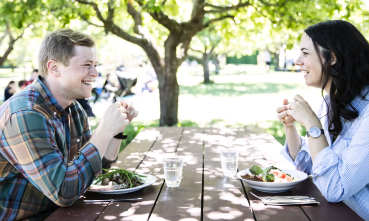 Joel and woman having lunch